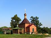 Церковь Димитрия Солунского, Вид с северо-запада. Временная деревянная церковь, построенная в начале 2000-х, за ней - строящийся новый храм.<br>, Шебанцево, Домодедовский городской округ, Московская область
