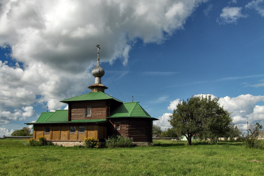 Церковь Иверской иконы Божией Матери, Захново (Печорский район, Псковская область). общий вид в ландшафте