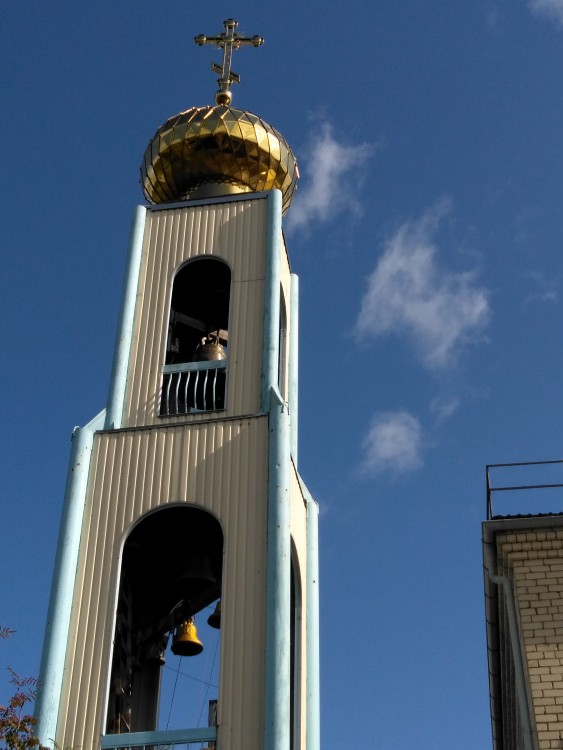 Церковь Рождества Пресвятой Богородицы, Илуксте (Аугшдаугавский край, Латвия). фасады, Верхний ярус колокольни и крест на ней