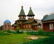 Церковь Успения Пресвятой Богородицы в Затулинке, Успенский храм и строящаяся часовня Собора Оптинских старцев, вид с северо-запада<br>, Новосибирск, Новосибирск, город, Новосибирская область