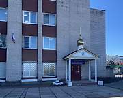 Церковь иконы Божией Матери "Спорительница хлебов", Вход в храм в СВ части административного здания , Большие Колпаны, Гатчинский район, Ленинградская область